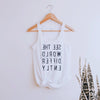White womens tank top with reverse print that says See The World Differently backwards