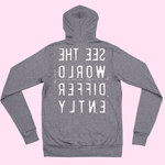 Heather gray hoodie that says 'See The World Differently' printed backwards on the back in reverse white lettering