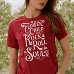 Woman wearing T-shirt with distressed white Flower Child With A Rock and Roll Soul graphic