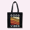 Black surfer tote bag with 'GOOD VIBES' rainbow