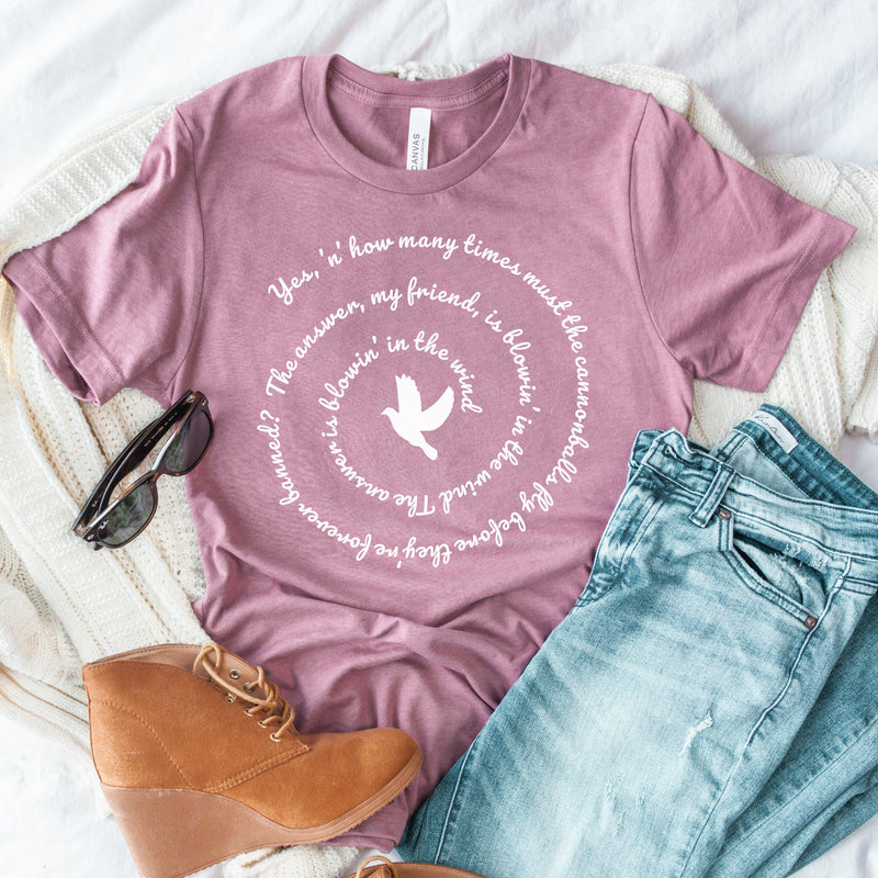 Womens tee shirt with bob dylan lyrics blowin' in the wind spiral graphic pairedwith jeans and suede boots