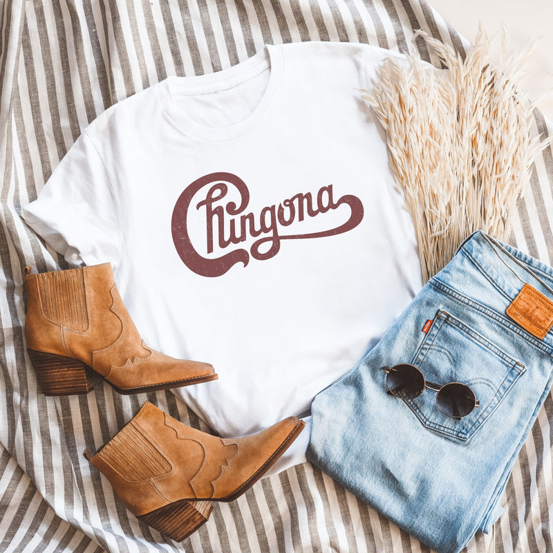 Womens white  t-shirt with Chingona graphic in red cursive that looks like the Chicago logo