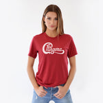 Pretty Woman wearing red t-shirt thst says Chingona in white cursive that looks like the Chicago logo