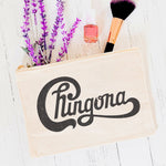 White canvas make-up bag that says Chingona in letters that look like the band Chicago