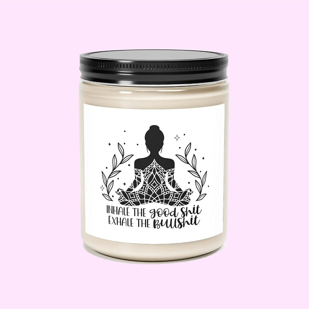 Funny yoga candle with yoga woman silhouette and print that says INHALE THE GOOD SHIT EXHALE THE BULLSHIT on a natural colored candle in a glass jar and black metal lid