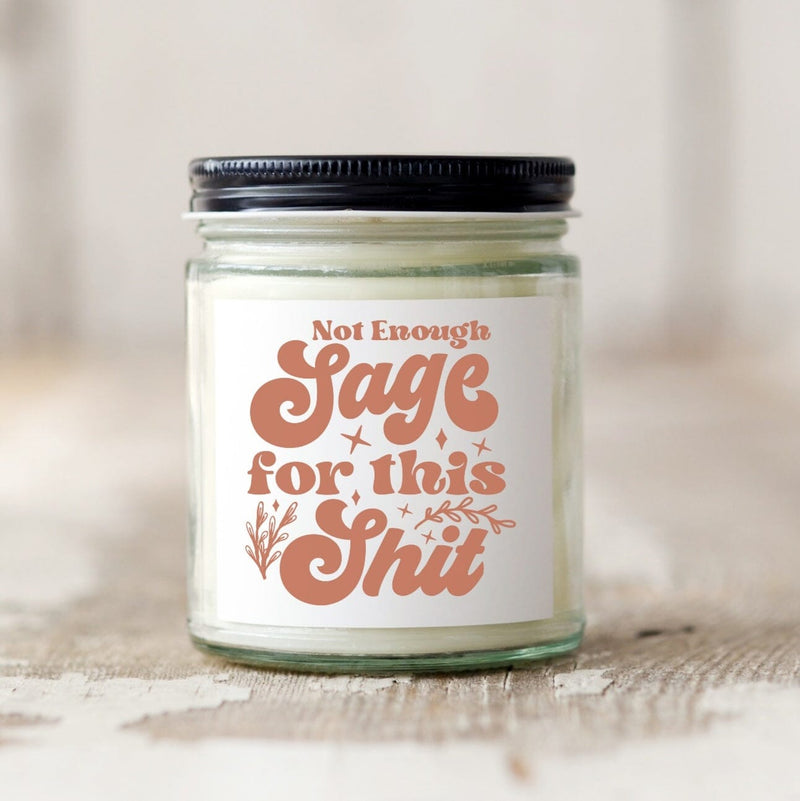 Retro jar candle with black metal lid, candle says "There's nit enough sage for this shit" in ambervintage bubble letters
