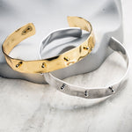 Gold and silver hammered cuff bracelets