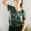 Womens heather forest green t-shirt with white HEAVILY MEDITATED graphic and a white moon in the center
