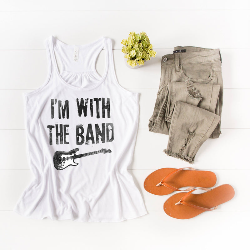 Womens white rocker racerback tank top with a distressed black guitar graphic on the front, and distressed black lettering that says 'I'M WITH THE BAND'