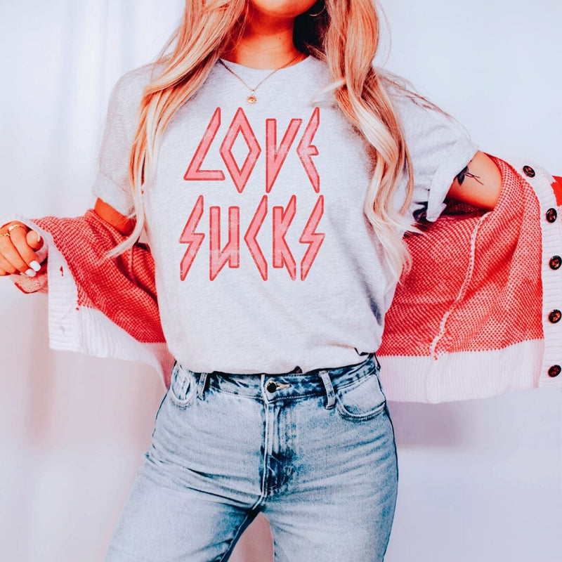 Womens LOVE SUCKS distressed tee shirt in Ash Gray with distressed pink writing