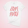 Womens LOVE SUCKS white distressed tee shirt with distressed pink writing