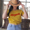 girl in hat wearing yellow mamacita shirt