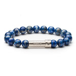 Blue lapis beaded bracelet with silver tube clasp that holds a paper message inside