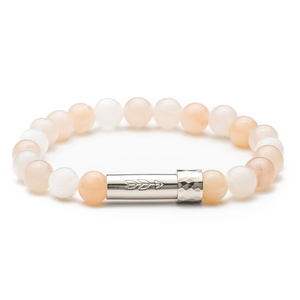 Light pink aventurine gemstone beaded intention bracelet with silver cylinder clasp that unscrews to hold a scroll of paper. Clasp features a handstamped arrow.
