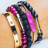 Dark pink and black gemstone beaded bracelet stack with gold secret message clasps