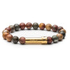 Earth-toned gemstone beaded wish bracelet that holds a wish inside the gold tube clasp
