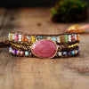 Leather boho wrap bracelet with large pink rhodonite  gemstone centerpiece