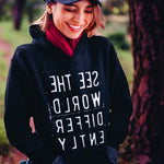 Black hoodie sweatshirt with reverse white letters that say See The World Differently backwards