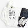 White hoodie sweatshirt with reverse black letters that say See The World Differently backwards