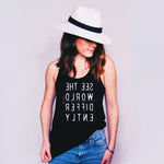 Woman in black tank top with white backwards letters that say See The World Differently