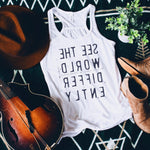 Wonens White tank top with black backwards letters that say See The World Differently 