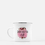 White camp mug with pink floral graphic and  that says SHUH-DUH-FUH-CUP