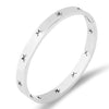 Stainless steel classic bangle bracelet with star cutout accents 