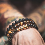 Mens beaded wish bracelets that hold secret message on paper inside the brass clasp