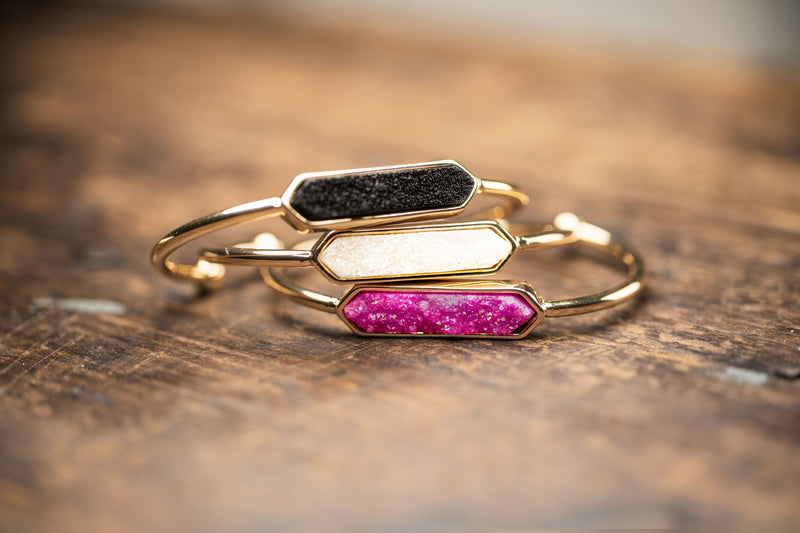 Gold druzy stone bracelets in black druzy, white druzy, and pink druzy